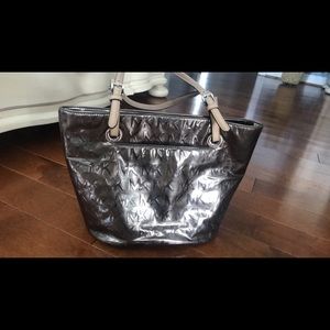 Gently used shiny Michael Kors purse. Asking 30
